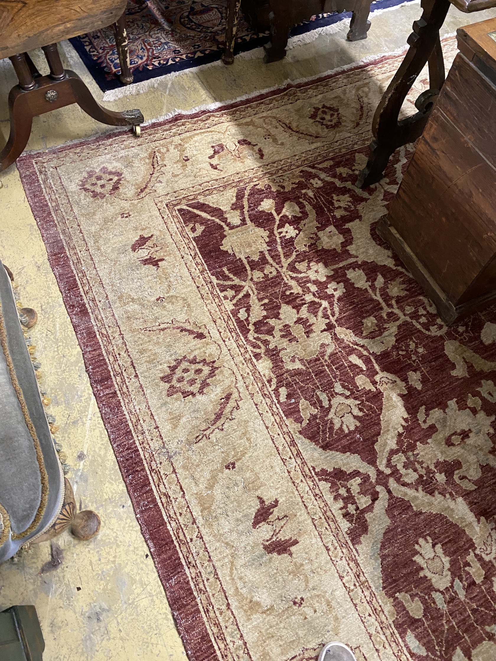 A Zeigler style burgundy ground carpet, 306 x 245cm